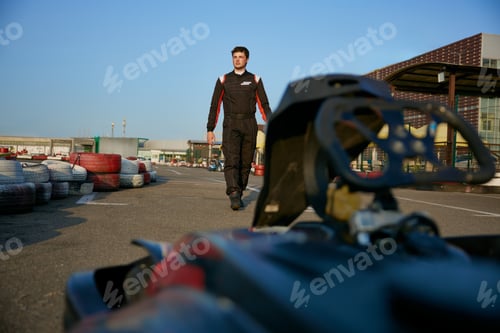 Preview: Race car driver preparing for karting competition