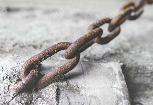 Preview: Rusty chain in the cement