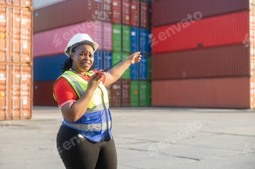 Preview: Female logistics worker communicating at container yard