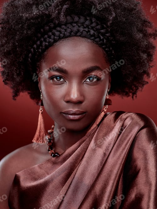 Preview: Cropped portrait of a beautiful young woman posing against a red background