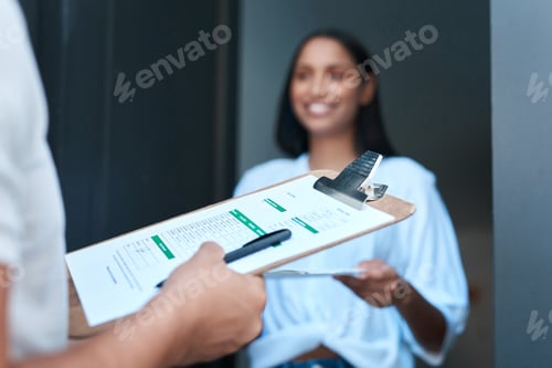 Preview: Thank you for the delivery. Shot of a young woman receiving a delivery at home.