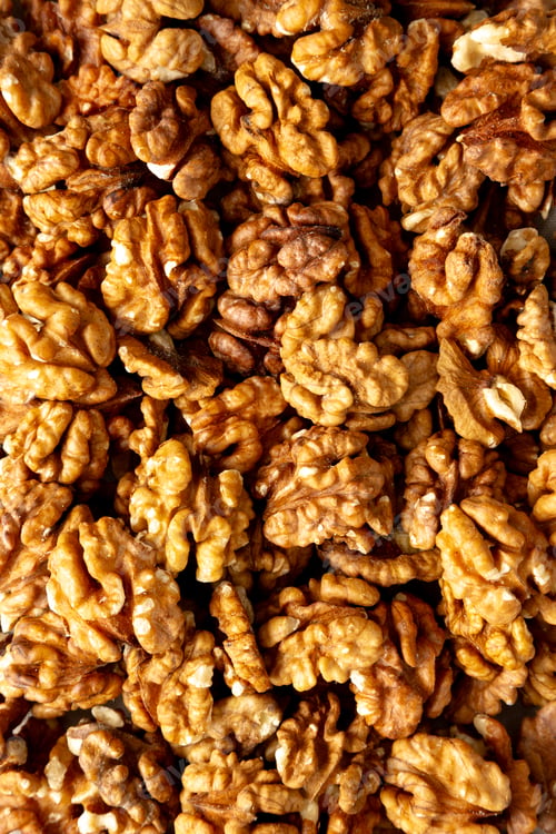 Preview: Raw Walnut Halfs, top view. Flat lay, overhead.