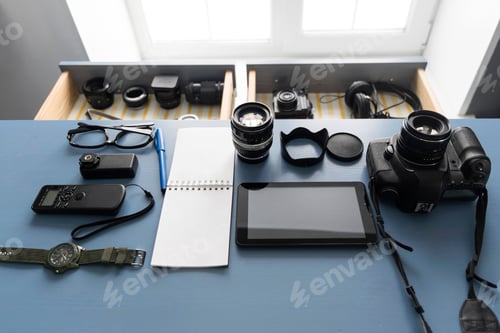 Preview: Overhead view of digital tablet and camera equipment on studio desk