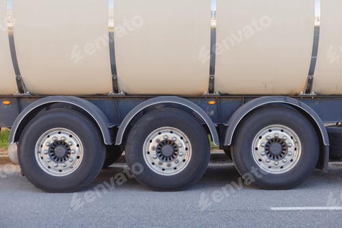 Preview: Industrial fuel gas cargo transportation. Close-up of rear wheel of truck, rear view with space for