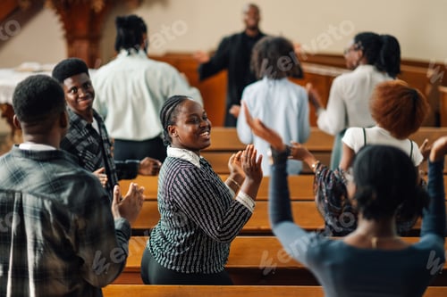 Preview: Group of people clapping hands and singing gospel music in church