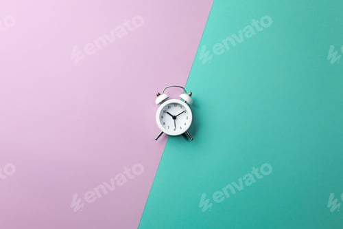 Preview: White alarm clock on colorful background. Concept in minimal style