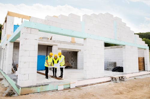 Preview: Architects and worker at the construction site.
