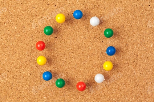 Preview: Group of thumbtacks pinned on corkboard