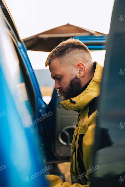 Preview: Pilot preparing for flight, checking equipment in aircraft