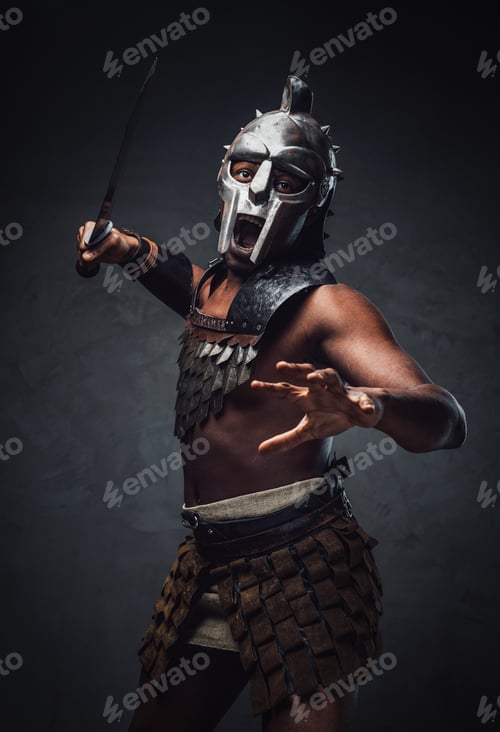 Preview: Proud antique gladiator with sword against dark background