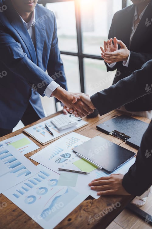 Preview: A group of Asian business people handshake to make a contract business agreement to start a new busi