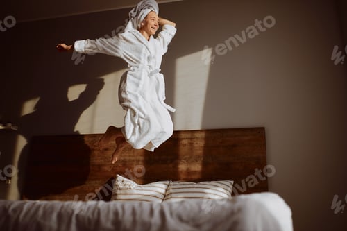 Preview: Young beautiful woman wrapped in towel