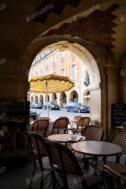 Preview: Paris, France. View of Cafe Hugo at Place des Vosges in Paris. Charming view from vaulted arcade. Sp