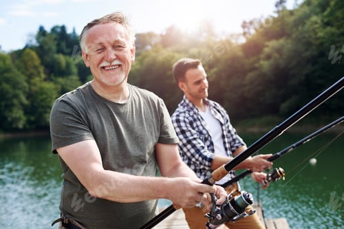 Preview: Portrait of cheerful senior man fishing
