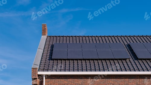 Preview: Newly build houses with solar panels attached on the roof against a sunny sky
