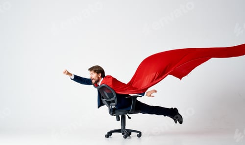 Preview: a man in a red cloak suit ride in a chair superheroes