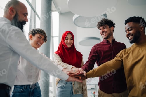 Preview: Business people joining hands, stacking hands, teamwork concept