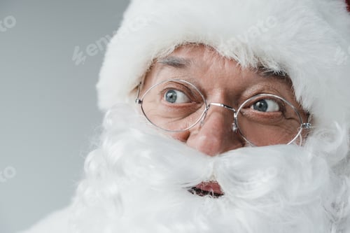 Preview: close-up portrait of cheerful santa claus in eyeglasses looking away
