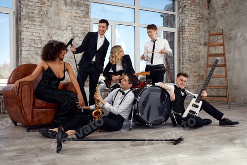 Preview: Repetition of multi ethnic jazz band in loft. Bass guitar player, electric guitar player