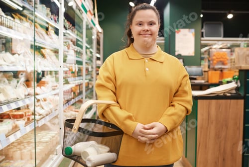 Preview: Girl with Down Syndrome in Supermarket Buying Groceries