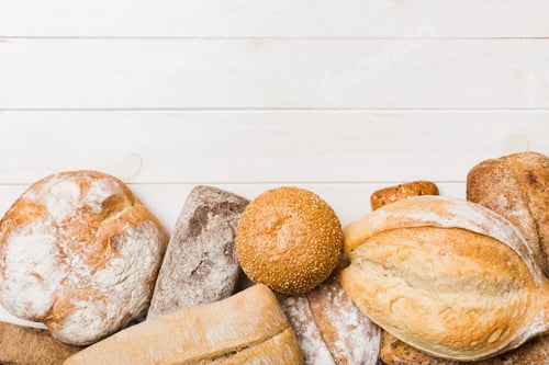 Preview: Homemade natural breads. Different kinds of fresh bread as background, top view with copy space