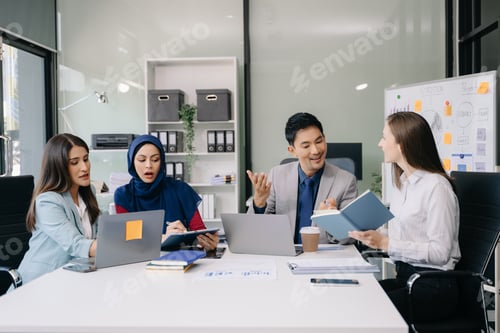 Preview: Creative business people working on business project in office