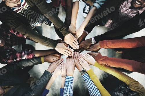 Preview: Aerial view of diverse people stacking hands in the middle