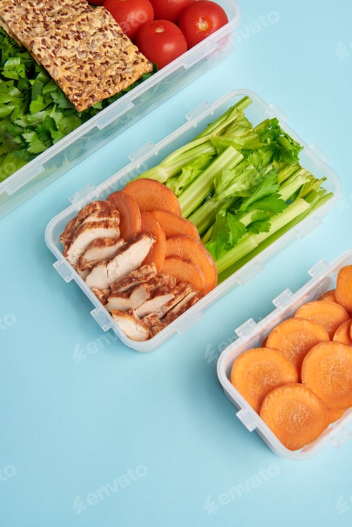 Preview: close up view of arrangement of food containers with fresh healthy vegetables and meat isolated on