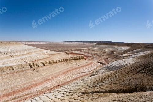 Preview: Desert landscape with layered rock formations.