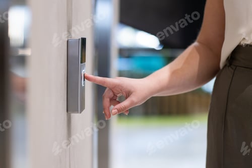 Preview: Pressing fingerprint scanner, woman accessing secure entrance of office building