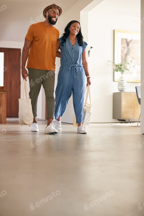 Preview: Couple Carrying Reusable Cotton Shopping Bags Retuning Home