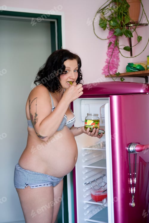 Preview: Pregnant woman eating pickles