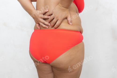 Preview: Rearview cropped fat adipose obese unhealthy woman with sagging flabs on back, tummy in red