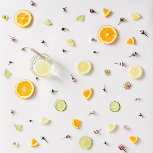 Preview: Citrus Fruit Slices and Flowers on White Background