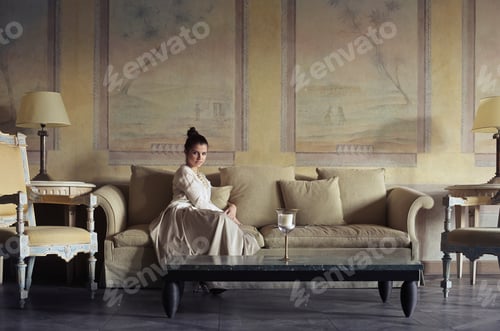 Preview: Girl sitting on a sofa