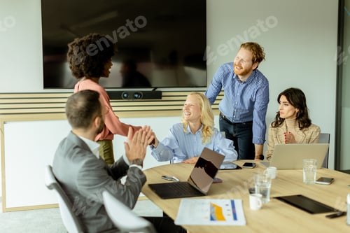 Preview: Diverse team engaging in collaborative efforts during a creative office meeting at midday