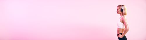 Preview: Music in my life. Side view of sporty blonde woman in headphones listening music while