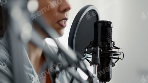 Preview: Internet live radio talk show host talking to audience at microphone