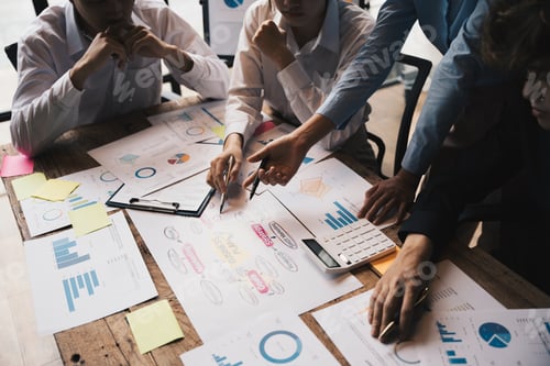 Preview: Close-up of businesspeople hands pointing a business plan sheet data,discussing, analyzing