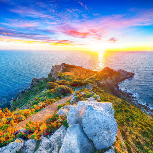 Preview: Dramatic spring sunset on the the cape Milazzo panorama of nature reserve Piscina di Venere.