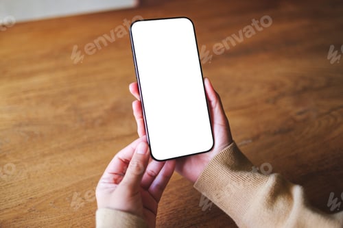 Preview: Mockup image of a woman holding mobile phone with blank desktop screen