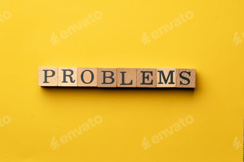 Preview: a yellow warm background without shadows wooden cubes with black letters laid out word problems