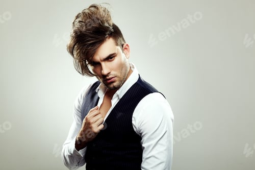 Preview: Fashionable man posing in the studio