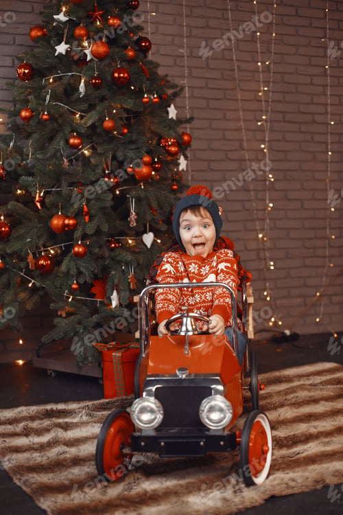 Preview: Cutte little boy at home near christmas decorations
