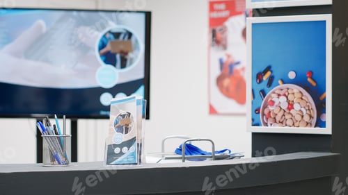 Preview: Empty hospital reception desk with medical equipment