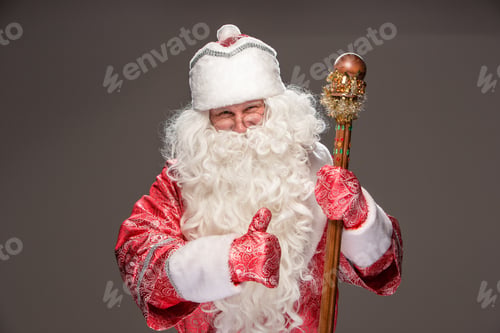 Preview: Happy Santa Claus In Eyeglasses With Staff Looking At Camera On Black Background