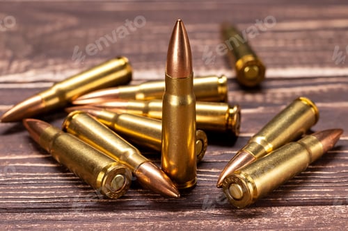 Preview: Bullets for Kalashnikov assault rifle on wooden background