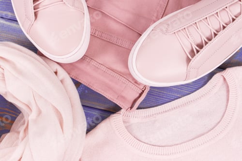 Preview: Leather shoes, sweater, shawl and pants for woman on old purple boards