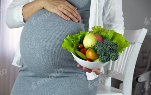 Preview: Pregnant Woman Holding Bowl of Fresh Vegetables
