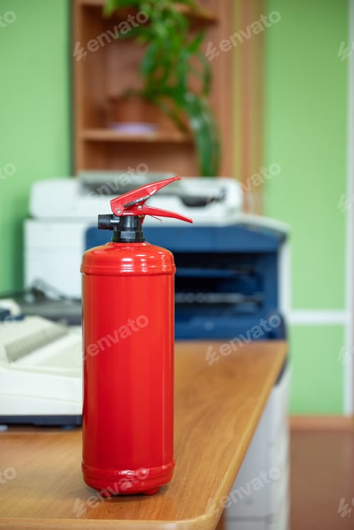 Preview: Fire extinguisher in workplace office. Fire safety